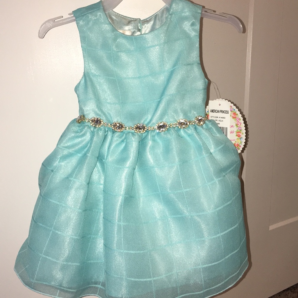 NWT dress with beautiful detail at waist.